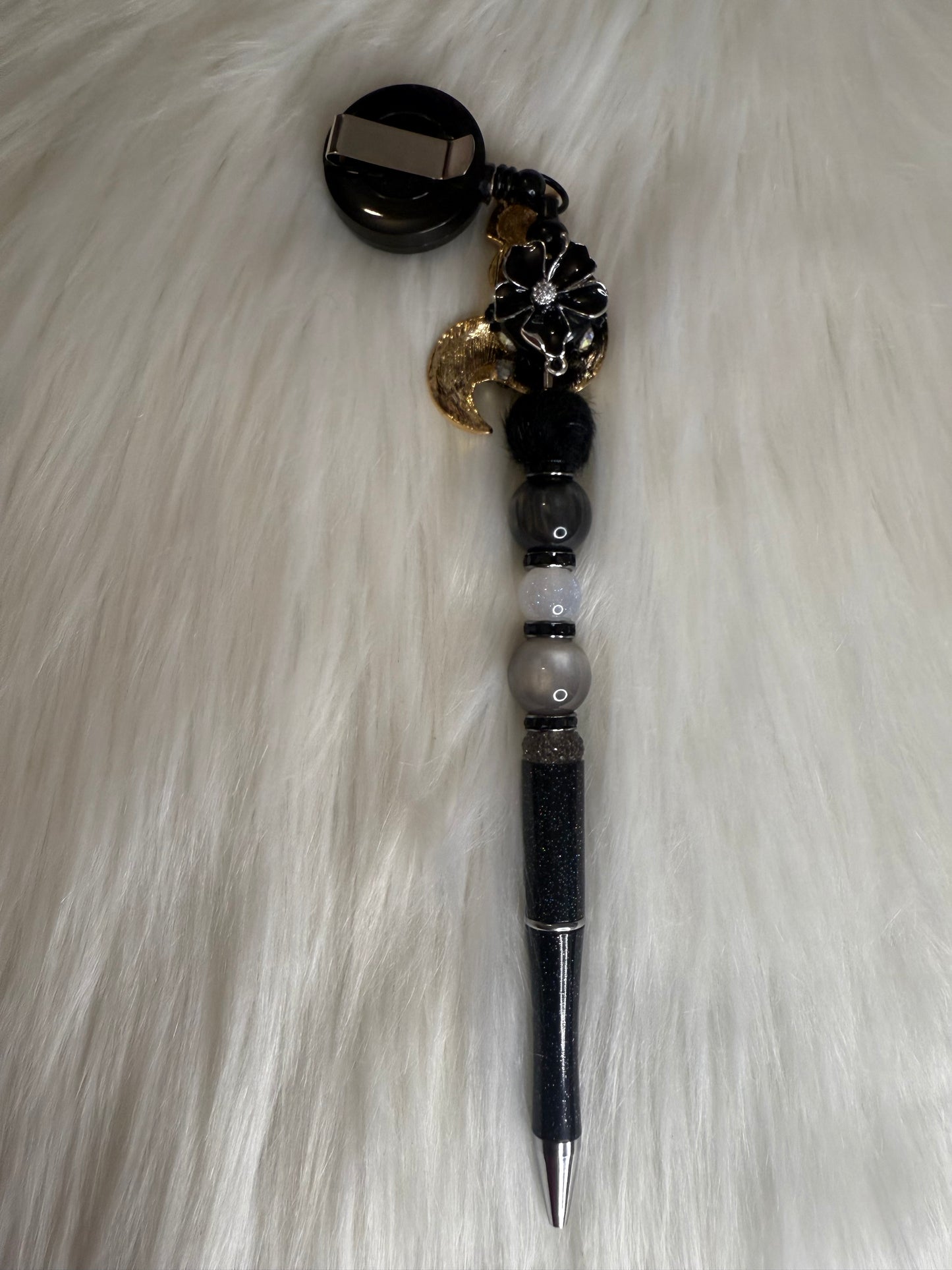 Beaded pen on a reel