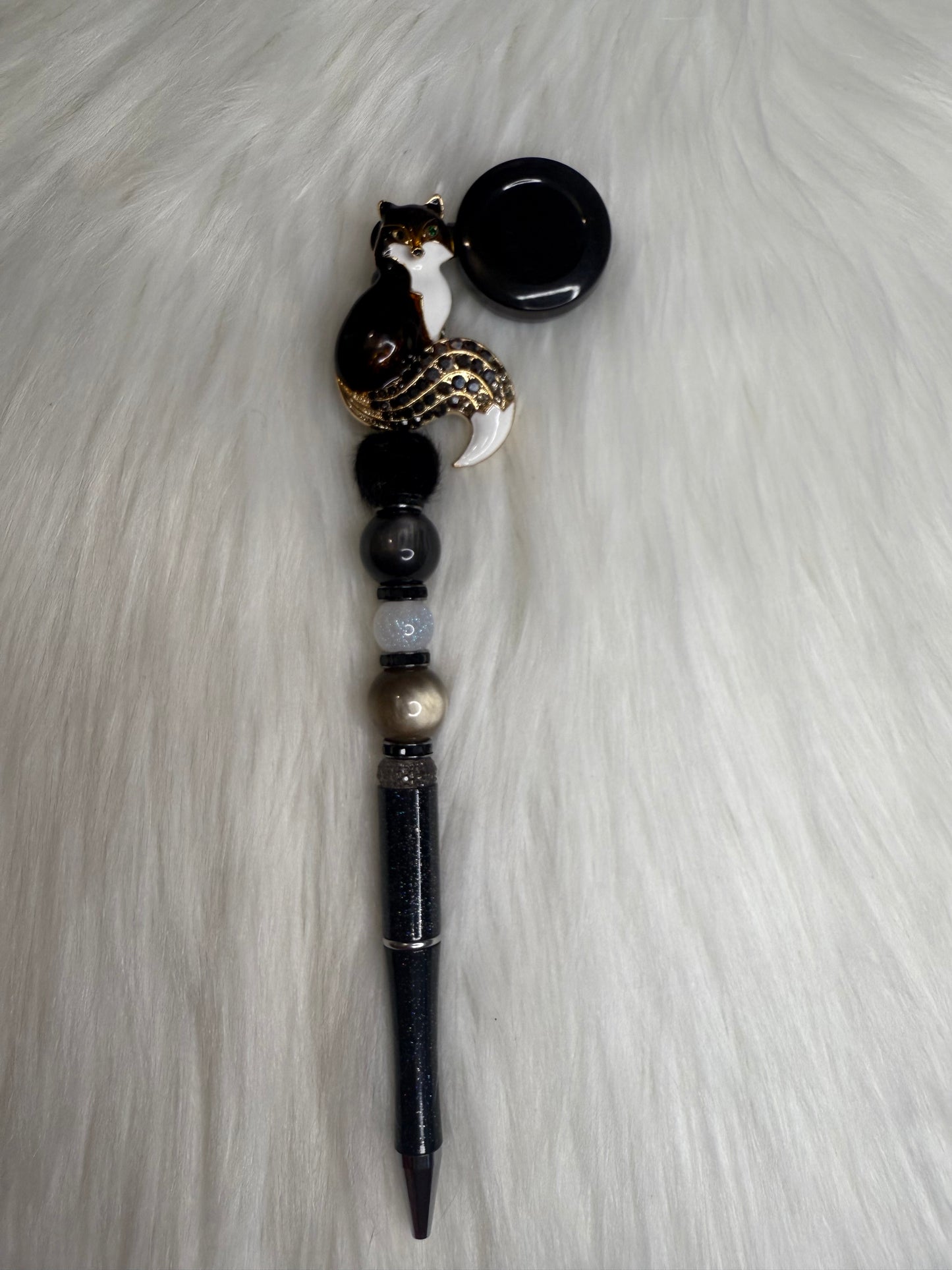 Beaded pen on a reel