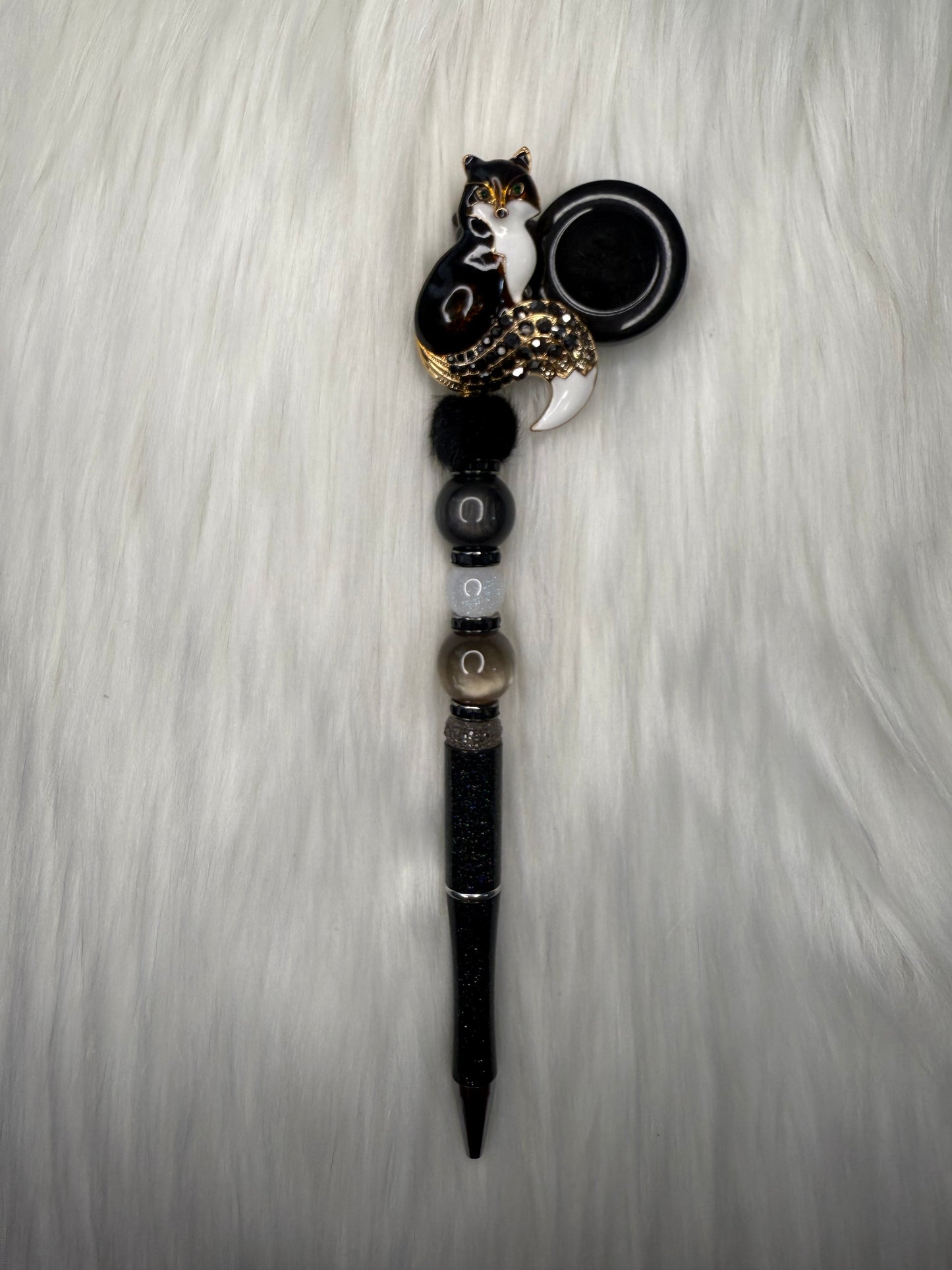 Beaded pen on a reel