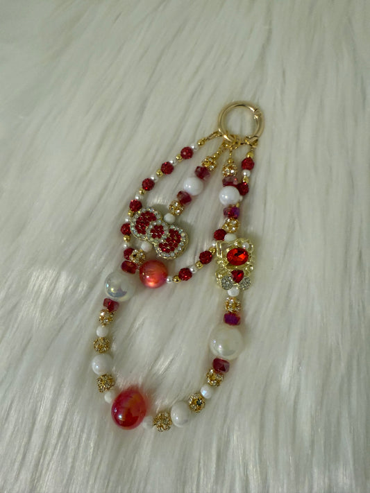 Pretty red and gold kitty & bow phone chain